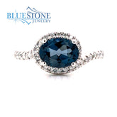 14 Karat White Gold Ring with One 1.43 Carat Oval London Blue Topaz an