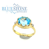 14 Karat Yellow Gold Ring with Blue Topaz gemstone and 2 Round Diamond