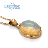 18 Karat Yellow Gold Pendant with an Oval Ethiopian Opal on a 18 Karat