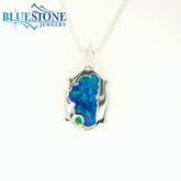 Small Silver Lake Tahoe Reversable Bear Pendant with Lab Grown Opal and Emerald.