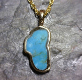 Large 14 Karat Yellow Gold Pendant with a Lake Tahoe Shaped Turquoise.