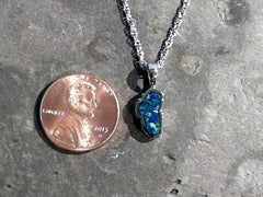 Small 14 Karat White Gold Lake Tahoe Pendant with Lab-Grown Opal.
MEA