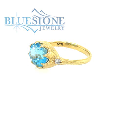 14 Karat Yellow Gold Ring with Blue Topaz gemstone and 2 Round Diamond