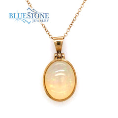 18 Karat Yellow Gold Pendant with an Oval Ethiopian Opal on a 18 Karat