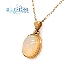 18 Karat Yellow Gold Pendant with an Oval Ethiopian Opal on a 18 Karat
