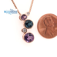 14 Karat Rose Gold Pendant with 2 Round Amethyst Gemstones and 1 Round