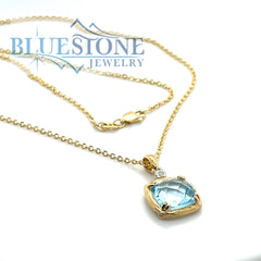 14 Karat Yellow Gold Pendant with a Blue Topaz and a 0.02 Carat Round