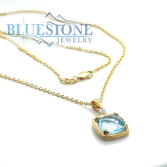 14 Karat Yellow Gold Pendant with a Blue Topaz and a 0.02 Carat Round