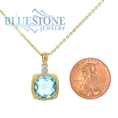 14 Karat Yellow Gold Pendant with a Blue Topaz and a 0.02 Carat Round