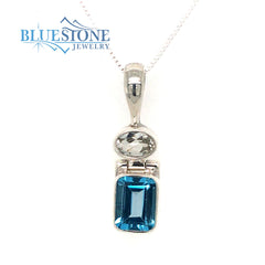Sterling Silver Rhodium Plated Pendant with One 6mm x 9mm Oval Cut Blu