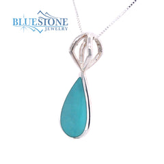 Sterling Silver Rhodium Plated Pendant with One Pear Cut Natural Turqu
