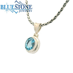 Small Sterling Silver Pendant with an Oval Cut Blue Topaz Gemstone. Pe