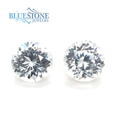 Two Loose Round Cut Genuine White Zircons. One Measures 6.4mm x 4.45mm