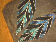 Gabriella Leather Feather Earrings on black leather with silver earrin