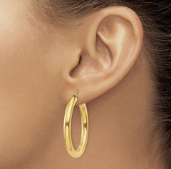 14 Karat Yellow Gold 4mm Tube Hoop Classic Earring. 35mm in length