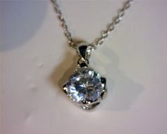 Sterling Silver Rhodium Plated Pendant with one round Cubic Zirconia a