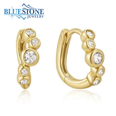 14 Karat Yellow Gold Plated Wave Hoops w/ 10 CZ Gemstones.