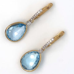 14K Latch back earrings with Small Blue Topaz Pear cuts with .14ct Dia