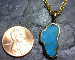 Large 14 Karat Yellow Gold Pendant with a Lake Tahoe Shaped Turquoise.