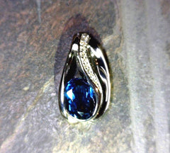 14 Karat White Gold Pendant with a 2.00 Carat Oval London Blue Topaz &